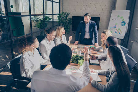We need act decisively. Photo of smart executive chief aged man tell his collars sit table desk unemployment way-out solution in workplace workstation boardroomの写真素材