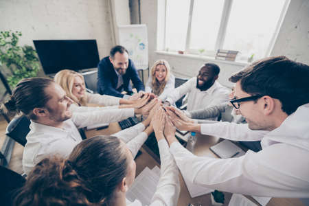 group of people have coaching training crisis way-out start-up conference develop unemployment strategy hold hand shake in workplace workstation boardroomの写真素材