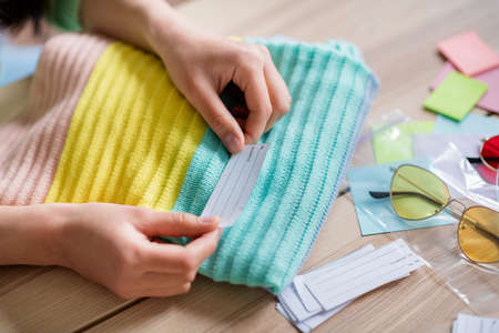 Close-up cropped view portrait of her she seamstress girl preparing textile things order cotton...