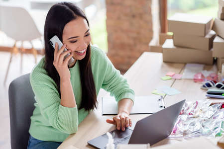 Portrait of her she nice beautiful brunette cheerful cheery girl talking on phone consulting courier...