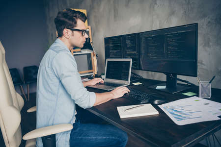 Profile side view portrait of his he nice skilled expert geek guy specialist solving problem remote...