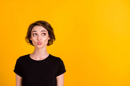 Close-up portrait of charming curious flirty girl thinking copy space pout lips isolated over bright...