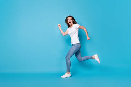 Full length body size profile side view of nice active sportive slim fit skinny cheerful cheery girl...