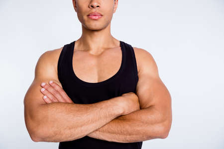 Close-up cropped view portrait of his he nice attractive sportive virile successful serious guy champion contest winner folded arms isolated over gray pastel color backgroundの写真素材