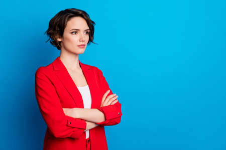 Profile side view portrait of lovely content serious brown-haired lady folded arms copy space isolated bright blue color backgroundの写真素材