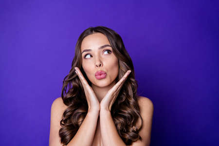 Photo of attractive charming girl look copyspace lips pouted isolated bright shine violet color backgroundの写真素材