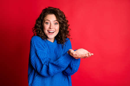 Photo of pretty lady wavy hairdo excited cheerful hands palms arms hold empty space toothy shiny...