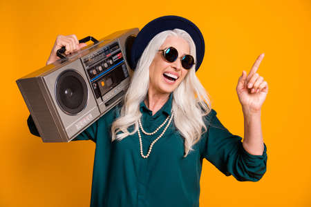 Photo of crazy cool granny lady music lover senior party tape recorder shoulder direct finger empty...