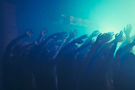 Photo of meeting careless dancing rejoice discotheque raise hands wear stylish outfit modern club indoorsの写真素材