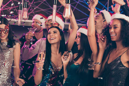 Photo of people party girl hold glass champagne rejoice wear trendy outfit santa claus cap modern...