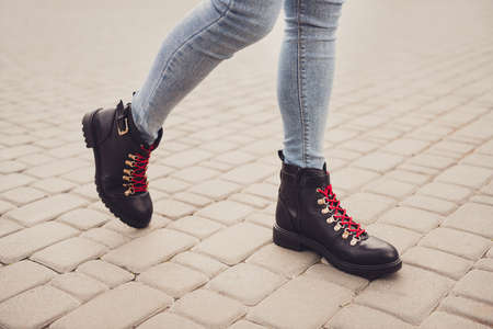 Cropped profile photo of fit lady legs tiptoe wear stylish black leather shoes boots denim jeans go...