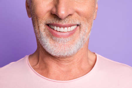Cropped photo of pensioner old bristled man white beaming toothy smile wear pink t-shirt isolated...