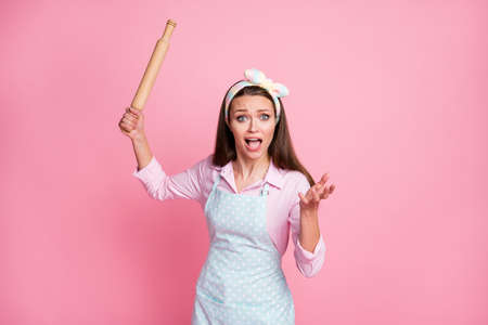 Portrait of frustrated outraged girl hold polling pin have terrible husband misunderstanding scream wear stylish shirt isolated pastel color backgroundの写真素材