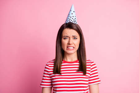 Photo of unhappy crying childish brunette hair lady dress hat t-shirt isolated on pink backgroundの写真素材