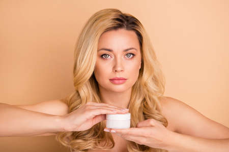 Close-up portrait of nice-looking attractive charming confident wavy-haired lady using new cream...