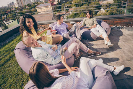 Top above high angle view photo of young positive smiling happy group of people sit armchair drink...