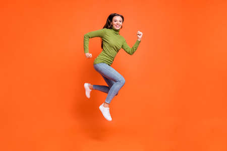 Full size profile sid photo of young active crazy girl have fun enjoy run jump happy smile isolated...