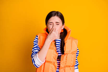 Photo of rescuer girl want save tourist life hold breath finger nose close eyes ready dive underwater ocean wear white ponytails lifejacket isolated bright shine color backgroundの写真素材