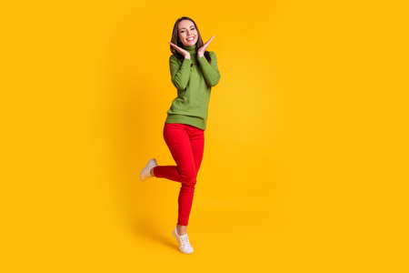 Full length body size view o pretty delighted cheerful thin girl jumping having fun isolated on...