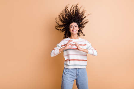 Photo of young latin girl happy positive smile gesture fingers small heart love valentine day...