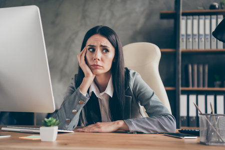 Photo of frustrated girl representative sit table work remote pc computer feel fear terrible company...