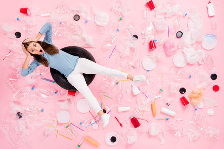 Top above high angle view full size photo crazy anxious girl sit swim tire water ocean dirty plastic...
