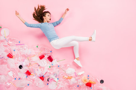 Top above high angle full body profile side photo of astonished girl fall many plastic rubbish cup...