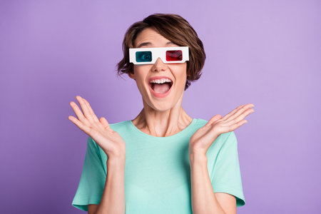 Photo of scared funny young lady wear casual teal outfit 3d film eyewear arms up isolated purple...