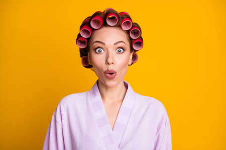 Photo of astonished girl spa salon treatment wear purple bath robe isolated bright color backgroundの写真素材