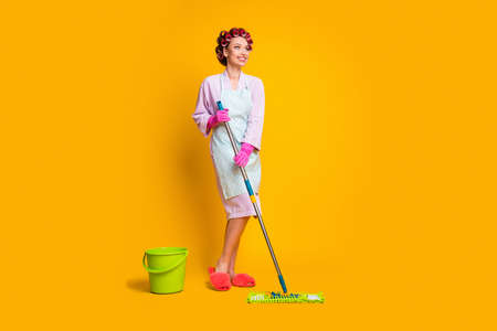 Full length photo of girl wash floor mop look copyspace wear bath robe slippers isolated bright...