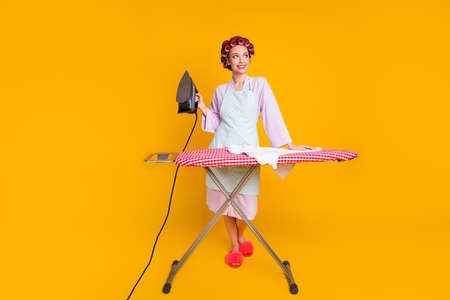 Full body photo of girl iron board fresh wash clothes look copyspace wear bath robe isolated bright color backgroundの写真素材