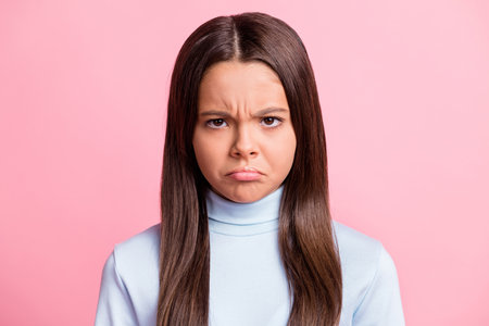 Close up photo of sad sullen brows lips young pupil girl casual outfit isolated on pastel pink color...