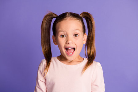 Close up photo of nice pupil person open mouth staring wear sweater isolated on violet color backgroundの写真素材