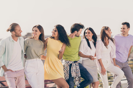 Photo portrait of young classmates company on meeting communicating smiling relaxing outdoors in summer dayの写真素材