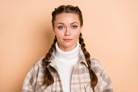 Photo of gorgeous cute young person tender smile friendly look camera isolated on beige color backgroundの写真素材