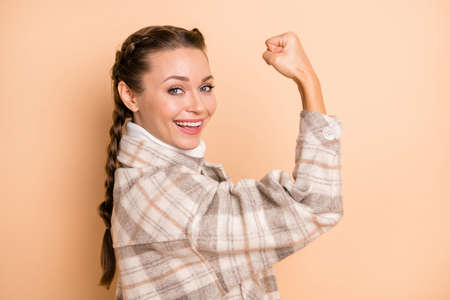 Profile photo of pretty carefree lady hand flexing biceps toothy smile wear checkered isolated on...