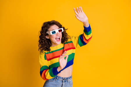 Photo of surprised pretty brunette curly hair young lady wear 3d spectacles watch movie cover...