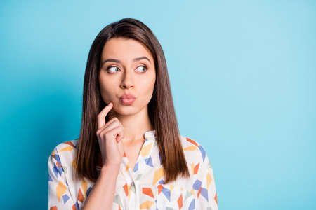 Photo of lovely young girl finger cheekbone look side empty space lips wear geometry print shirt...