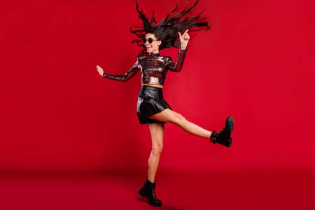 Full length photo of girl dance wear glossy top specs short skirt footwear isolated red color...