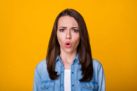 Portrait of astonished girl hear wonderful novelty cant believe wear good look clothes isolated over vibrant color backgroundの写真素材