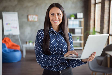 Photo of young attractive beautiful smiling happy cheerful good mood businesswoman hold laptop...