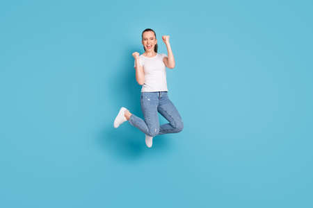 Full body photo of energetic delighted girl celebrate lucky spring season discounts lottery win jump...