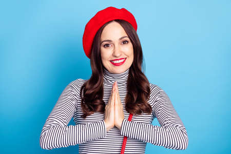 Photo portrait of girl smiling in beret striped turtleneck asking wish happy cute isolated vibrant blue color backgroundの写真素材