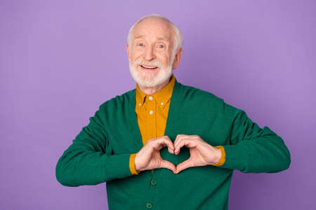 Photo of positive person finger make heart figure toothy smile isolated on pastel violet color backgroundの写真素材