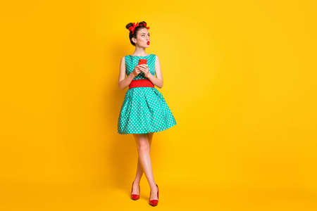 Full body photo of girl use cellphone look copyspace lips plump wear green skirt isolated bright color backgroundの写真素材