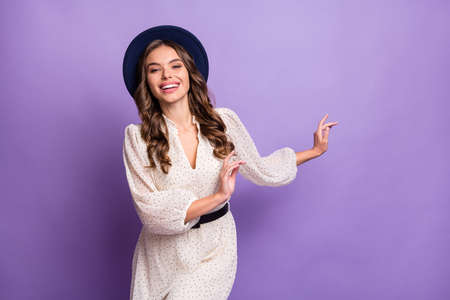 Photo portrait of cheerful model wearing black hat white dress dancing at party isolated on pastel...