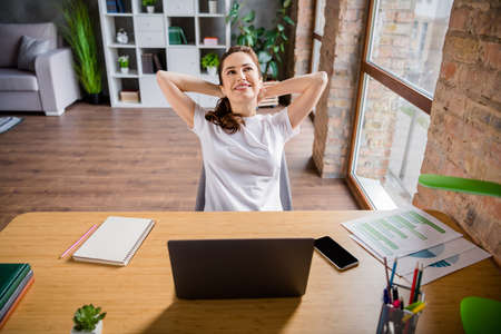 Photo of young dreamy positive cheerful charming businesswoman look in copyspace having break from...