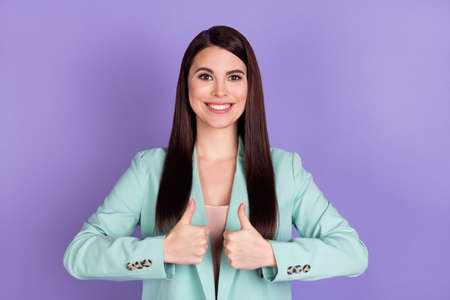 Photo of beautiful happy nice woman show thumbs up smile recommend like isolated on violet color...