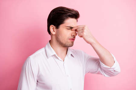 Profile portrait of sad guy headache hand face wear white shirt isolated on pink color background