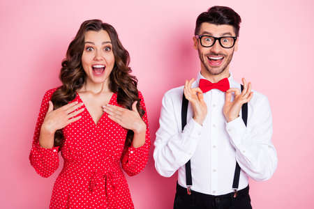 Portrait of nice impressed brown hair couple hands chest she wear dress he shirt isolated on pastel...